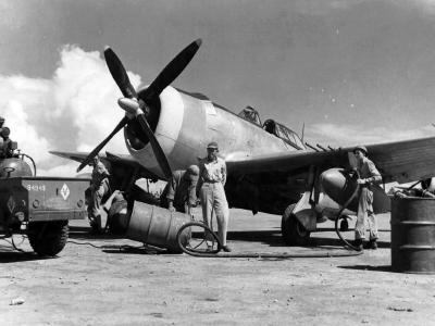 Mechanics of the 333rd Fighter Squadron, 318th Fighter Group Force napalm into 165 gallon fuel tank of P-47