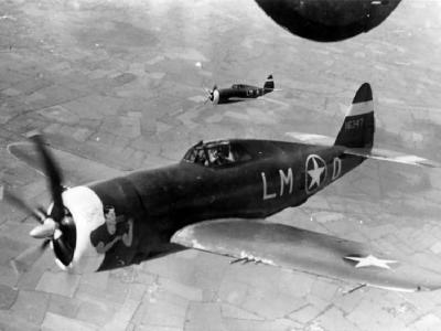 P-47C Thunderbolt code LM-O 41-6347 of the 56th Fighter Group escort a B-24