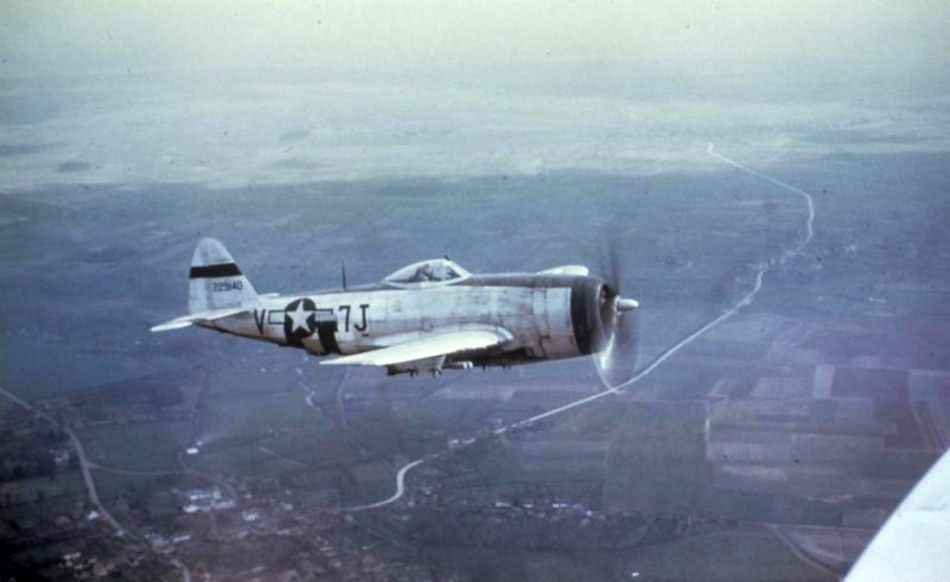 P-47 Thunderbolt 7J-V, 42-29140 of the 404th Fighter Group, 508th Fighter Squadron in flight over Belgium, March 1945