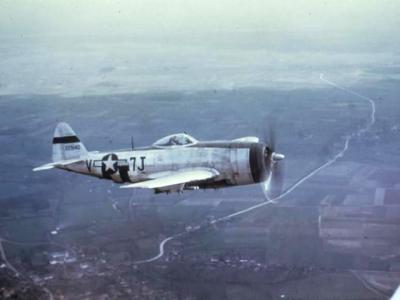 P-47 Thunderbolt 7J-V, 42-29140 of the 404th Fighter Group, 508th Fighter Squadron in flight over Belgium, March 1945