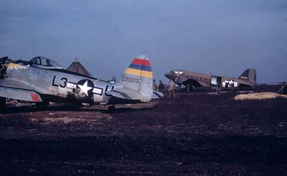 P-47 Thunderbolt L3-U, serial 42-26922 „Little Ann” of the 406th Fighter Group, 512th FS and C-47 in the background