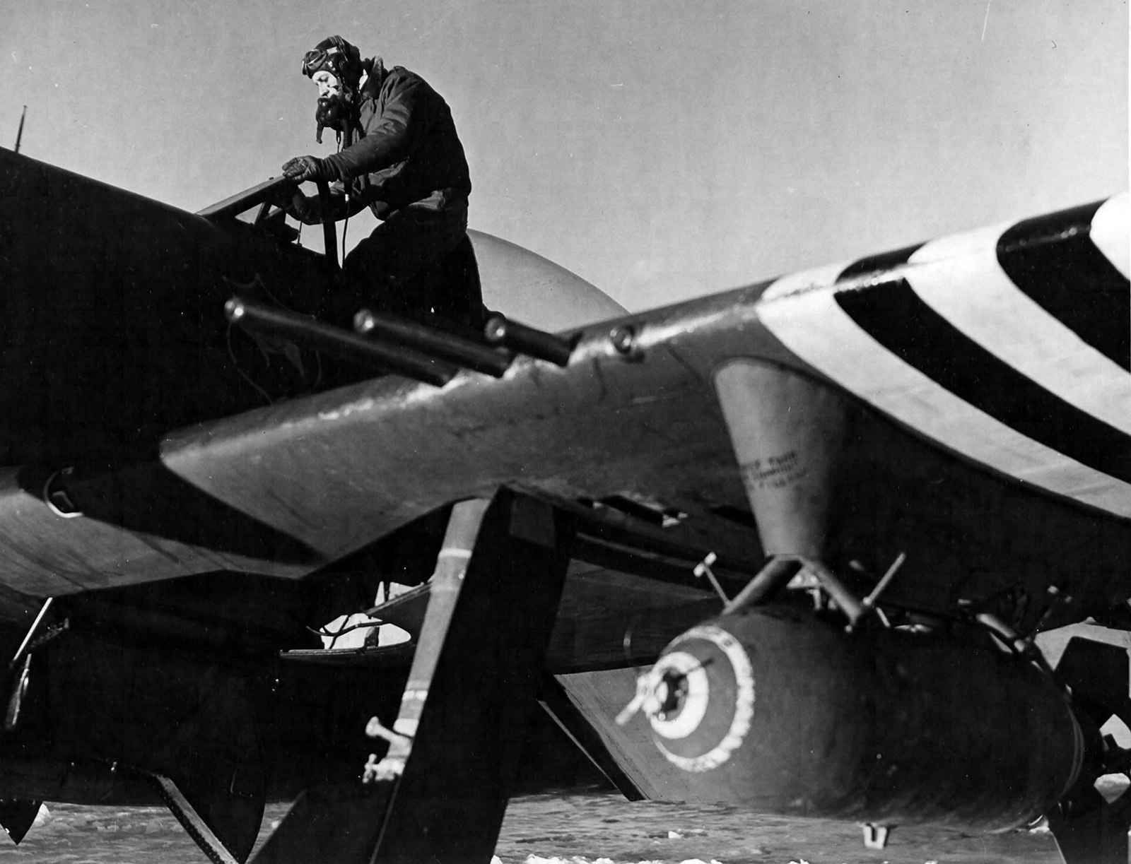 French pilot lt George Gauthier flying with First Tactical AF climbs into his P-47D Bubbletop