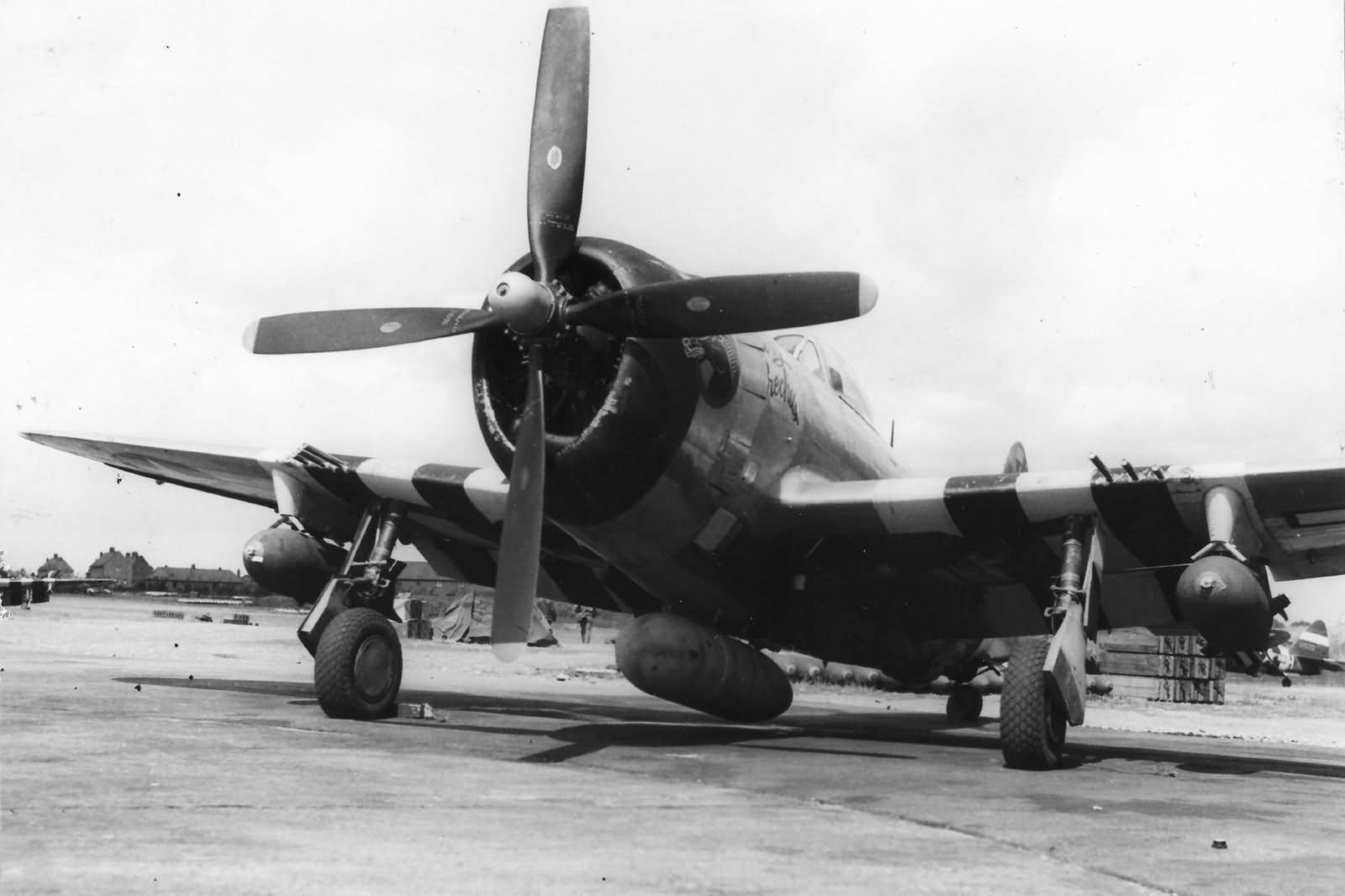 P-47 Thunderbolt with D-Day Invasion Stripes of the 366th FG sits on its hardstand on the northeast corner of Thruxton airfield England, June 1944