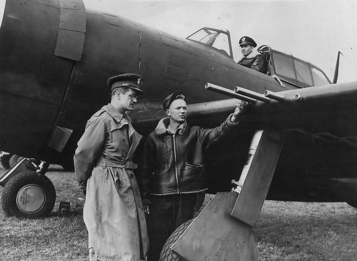 Pilot Inspects Guns on P-47 Thunderbolt at Base in England 1943