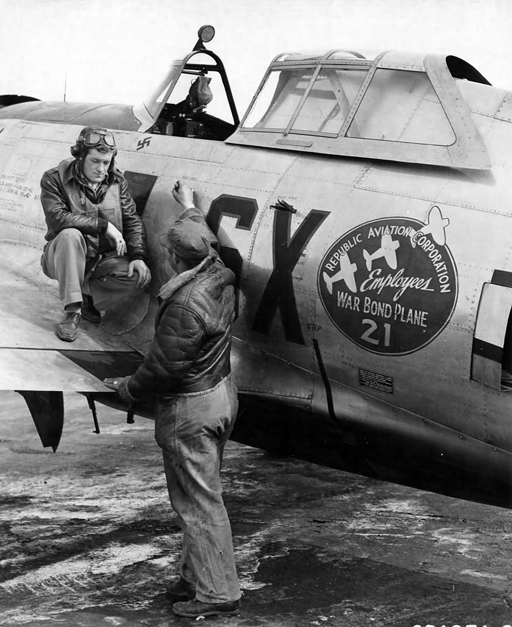 Lt Donald J. Corrigan of the 352nd FS, 353rd FG with his crew chief and P-47D 42-25771, code SX I