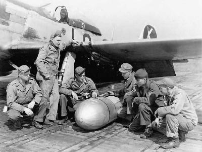 Ground Crew Ready To Attach Drop Tank To P-51 D Mustang code LC-X of the 20th FG 77th Fighter Squadron