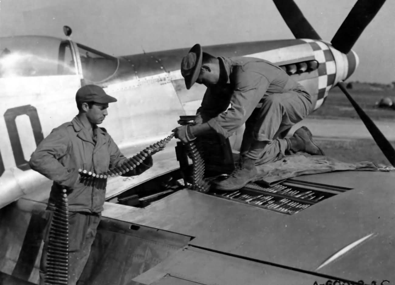 Putting Ammunition Belts In A North American P-51 Mustang In England 3 September 1944