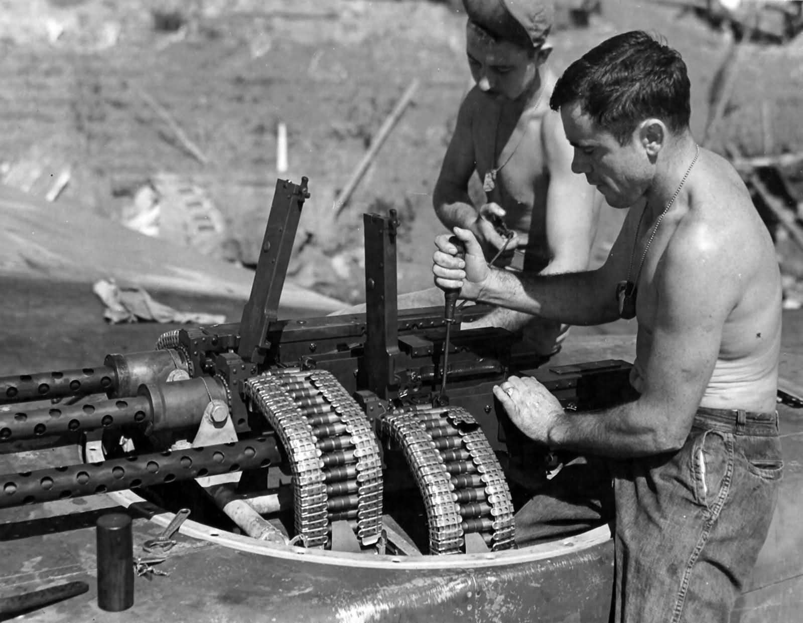 Servicing the four guns in the top turret of a P-61 Black Widow Four 12,7 mm Brownings