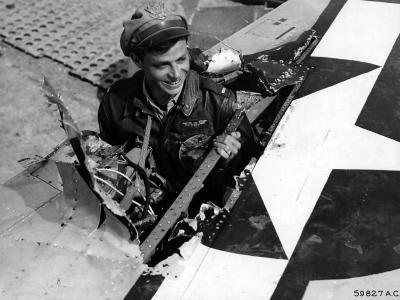 21 December 1944 – lt Henehan of the 346th FS, 350th Fighter Group stands in the hole in his P-47 left wing