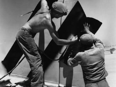 318th Fighter Group crew paint tail markings onto a P-47 Thunderbolt