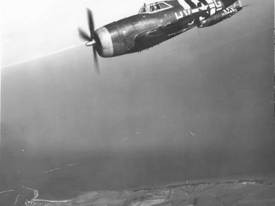 56th Fighter Group, 61st Squadron P-47 Thunderbolt code HV-G in flight – D-Day Stripes