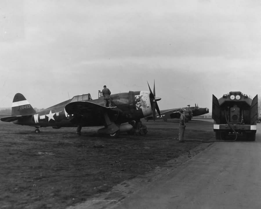 Ground crew of the 355th Fighter Group refuel P-47 Thunderbolt 42-8492