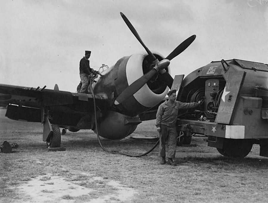 Ground personnel of the 78th Fighter Group refuel a P-47 Thunderbolt at Duxford August 1944