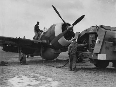 Ground personnel of the 78th Fighter Group refuel a P-47 Thunderbolt at Duxford August 1944