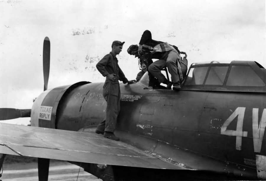 Lt Col Jim Daley of the 371st FG climbs out of his P-47 after a mission August 1944