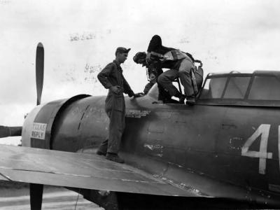 Lt Col Jim Daley of the 371st FG climbs out of his P-47 after a mission August 1944