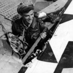 21 December 1944 – lt Henehan of the 346th FS, 350th Fighter Group stands in the hole in his P-47 left wing