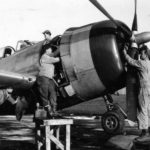 Ground crew carry out checks and maintenance work on P-47D-30-RE Thunderbolt, code HV-X 44-20626