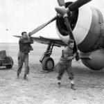 Ground crew of the 78th Fighter Group manually start the engine of a P-47 1943