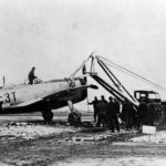 P-47D of the 22nd FS, 36th Fighter Group is extricated from the mud of Le Culot airfield A-89 Belgium December 1944