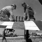 Armorers of the 366th FG service the weapons on a P-47 Thunderbolt at St Pierre du Mont airfield A-1, June 1944