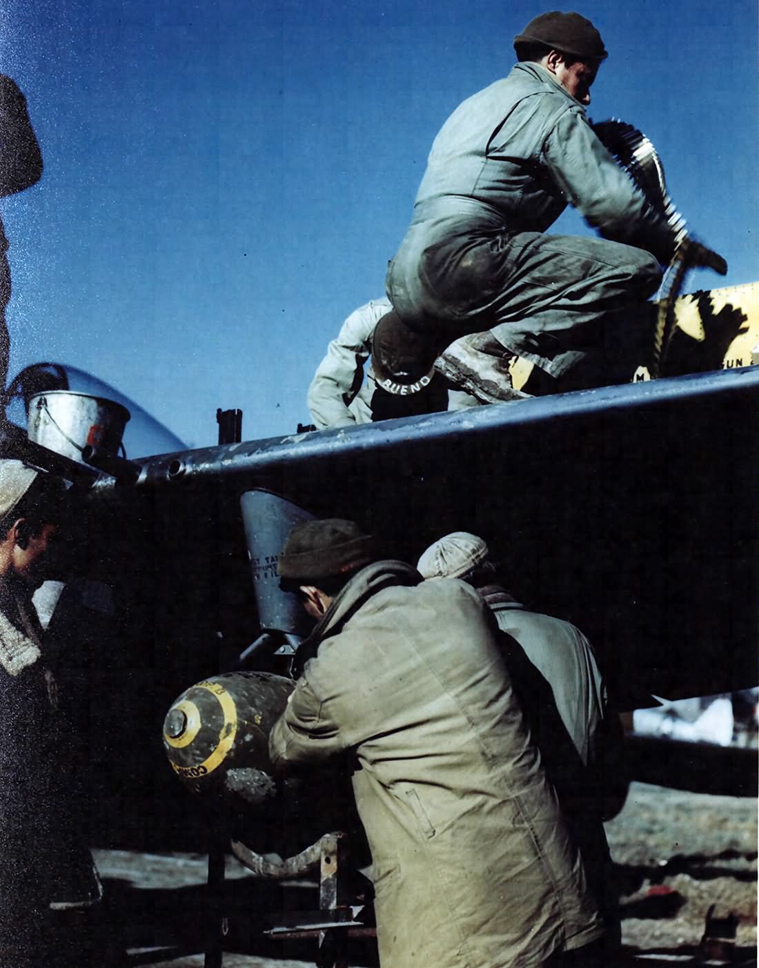 An armament crew of 1st Brazilian FS prepares P-47 for a mission Italy