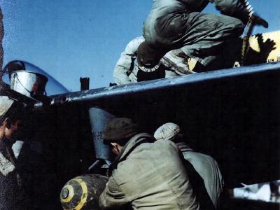 An armament crew of 1st Brazilian FS prepares P-47 for a mission Italy