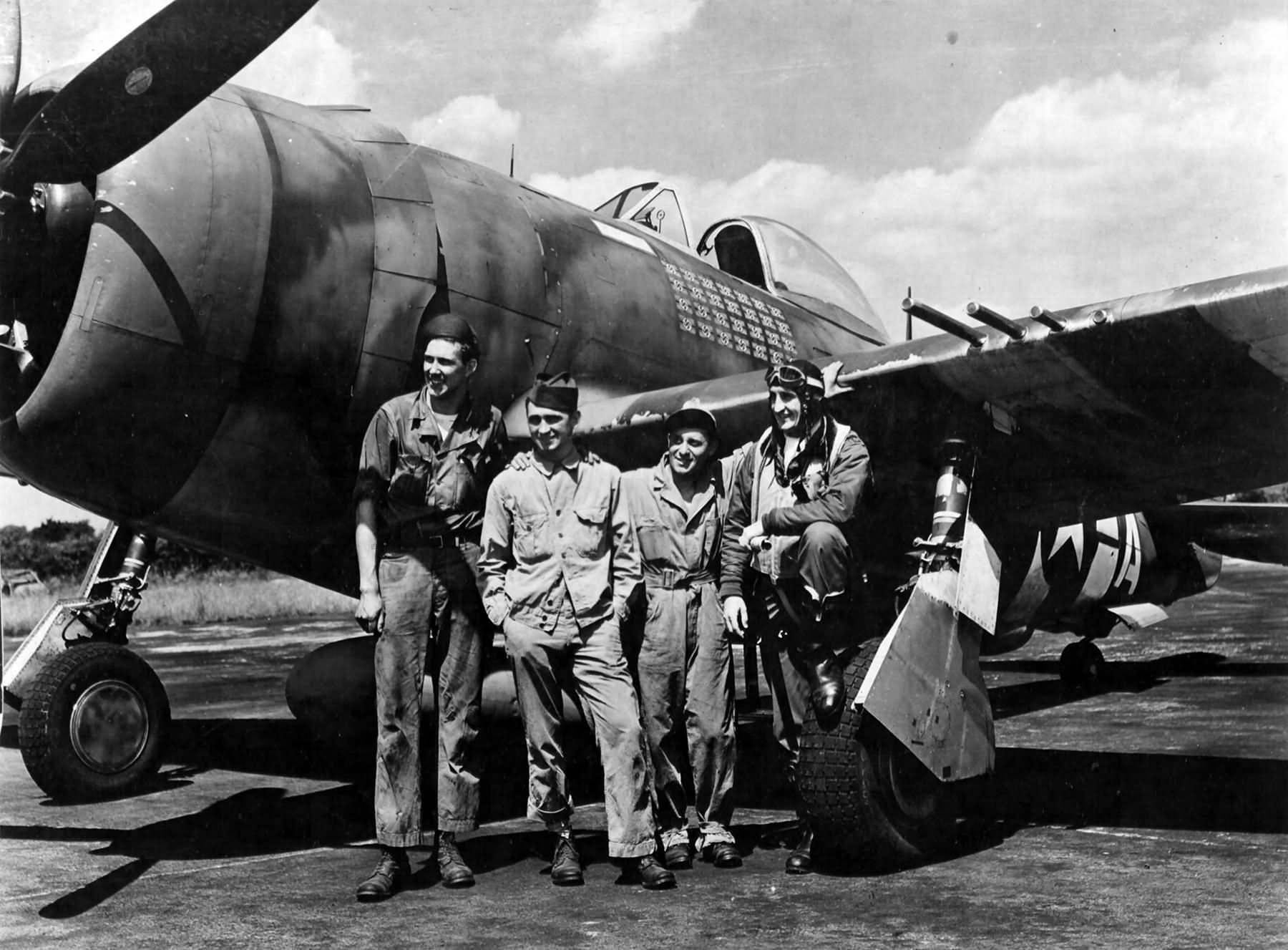 ltCol Gabreski of the 61st FS, 56th Fighter Group stands with the ground crew