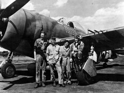 ltCol Gabreski of the 61st FS, 56th Fighter Group stands with the ground crew