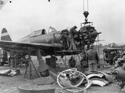 mechanics removing the engine from a P-47 at Duxford September 1943
