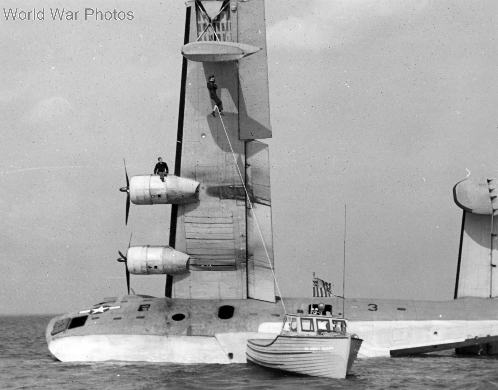 Coast Guard small craft supports efforts to right a PB2Y