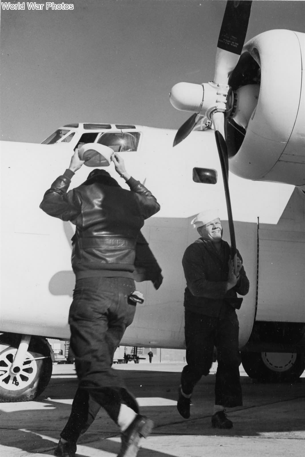 Ground crew rotating the propeller of the PB4Y-1 at NAS Norfolk