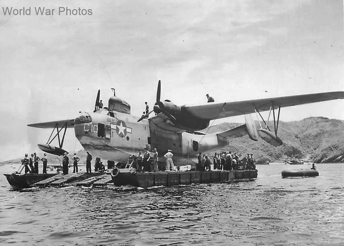 Seabees use pontoon lighter barge to move PBM-5 on Okinawa