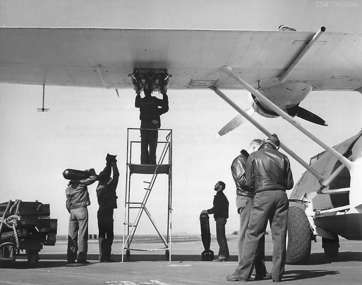 Coast Guardsmen load water bombs on Catalina in Argentia ’44