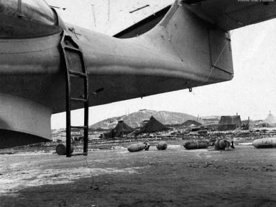 PBY-5 and bombs in foreground Navytown Adak 12 December 1942