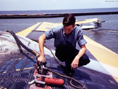 Sailor refueling a PBY trainer at NAS Corpus Christi August 1942