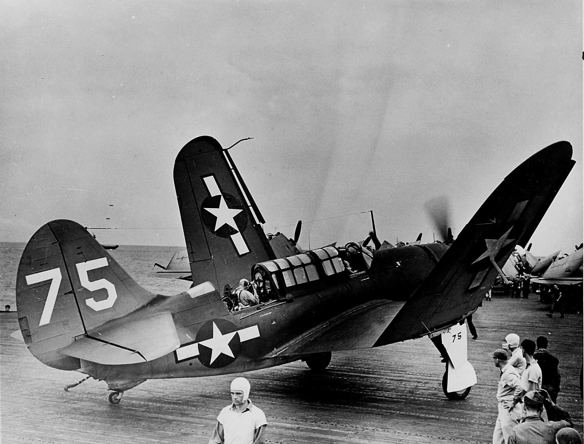 SB2C-3 ’75’ of VB-19 on the flight deck of the carrier USS Lexington (CV-16) after returning from a combat mission in the Pacific on August 20, 1944