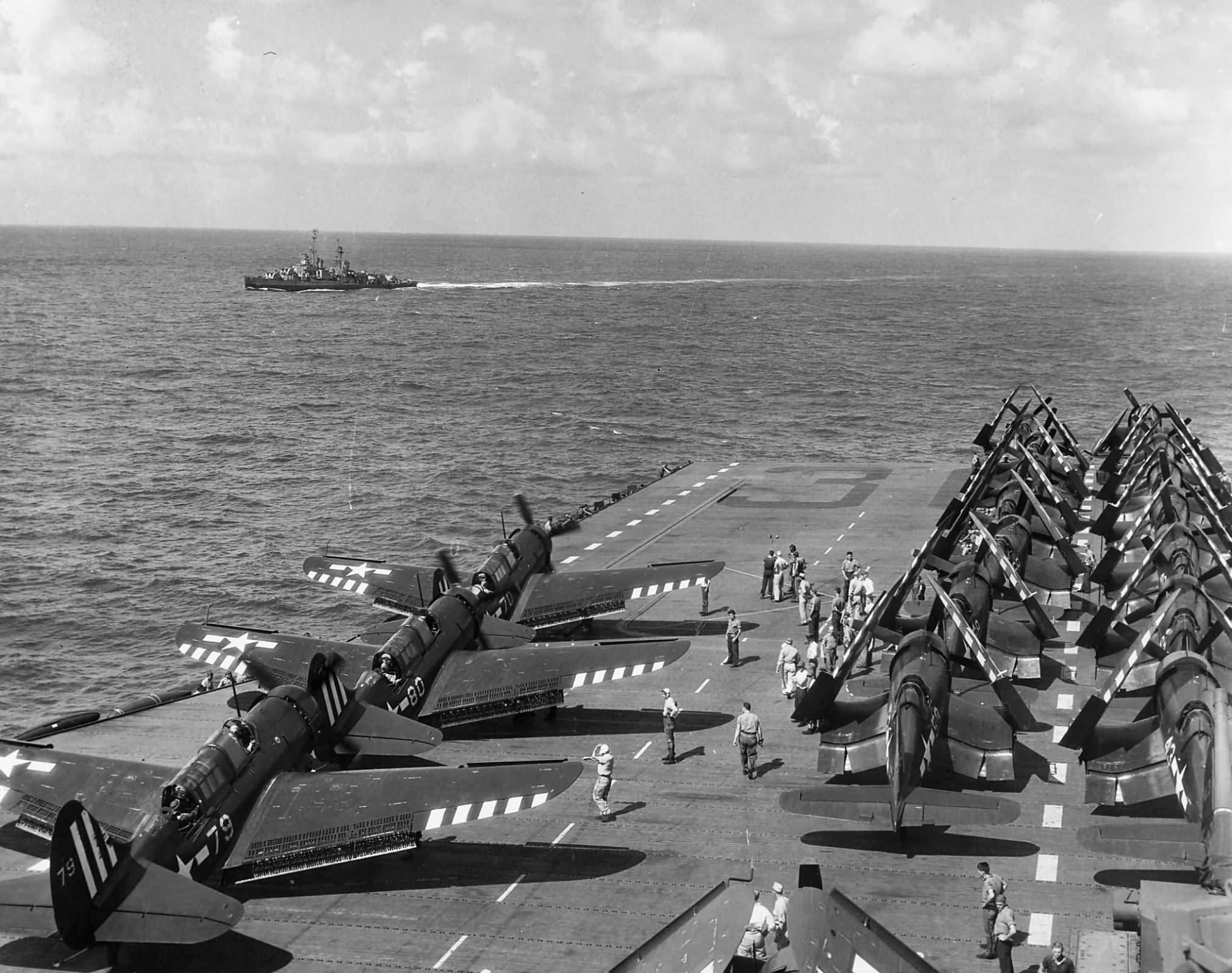 Curtiss SB2C-5 of VB-89 and F4U lined up for launch on the flight deck of the carrier USS Antietam (CV-36) on 14 August 1945