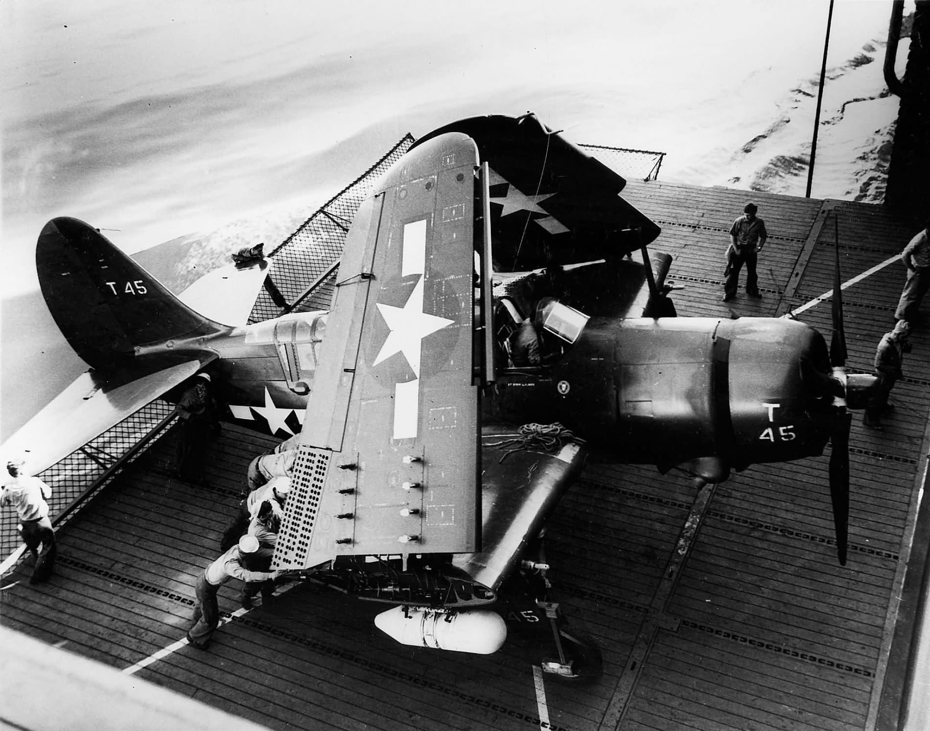 SB2C-5 Helldiver coded T45 of VB-95 on elevator of the carrier Bunker Hill, October 1945
