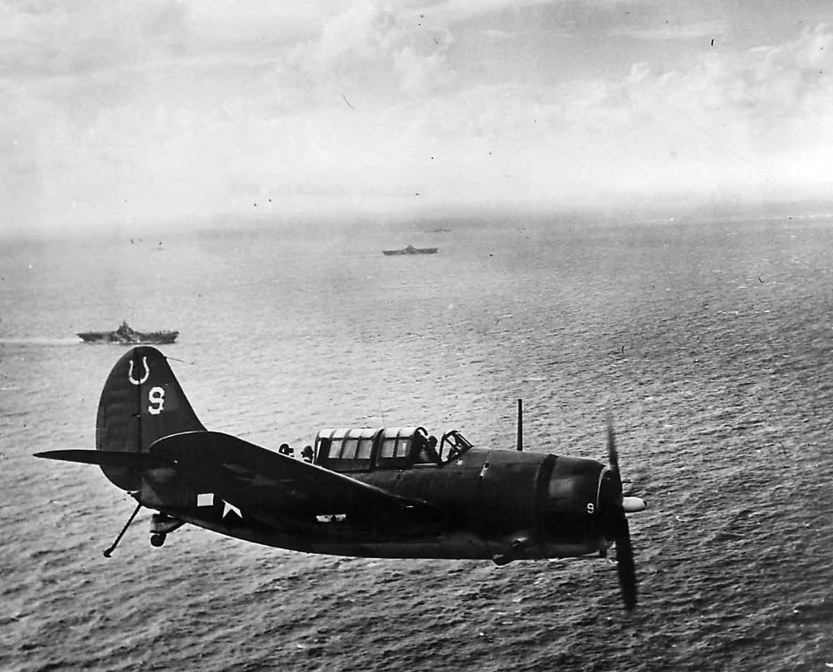 Curtiss SB2C Helldiver ‚9’ of VB-7 flying over USS Hancock (CV-19) off Formosa on 13 October 1944