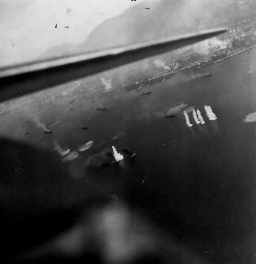 Ships in the harbor at Hong Kong under attack by Helldivers of VB-11 USS Hornet (CV-12 on 16 January 1945