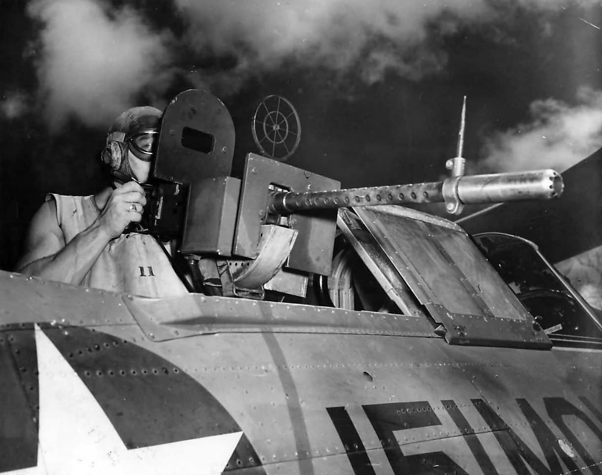 Rear gunner mans machine gun on SBC BuNo 1843 coded 151-MO-9 of the VMO-151