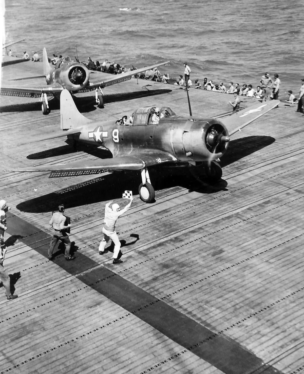 SBD-5 Dauntless white 9 prepare to take off from aircraft carrier