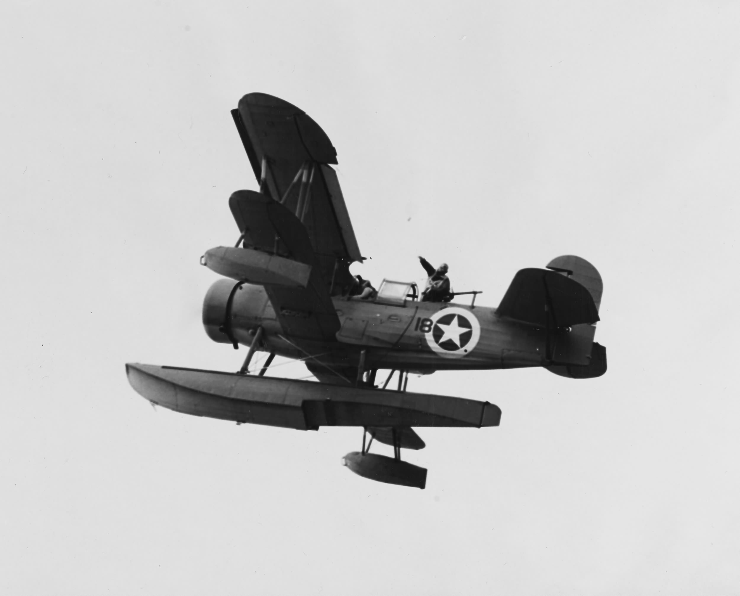 Curtiss SOC #18 drops a message as it flies over USS Augusta (CA-31), North Africa in November 1942