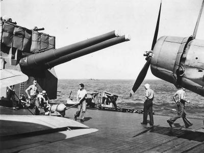 Carrier reloading crew rushing bombs to returning planes 1942