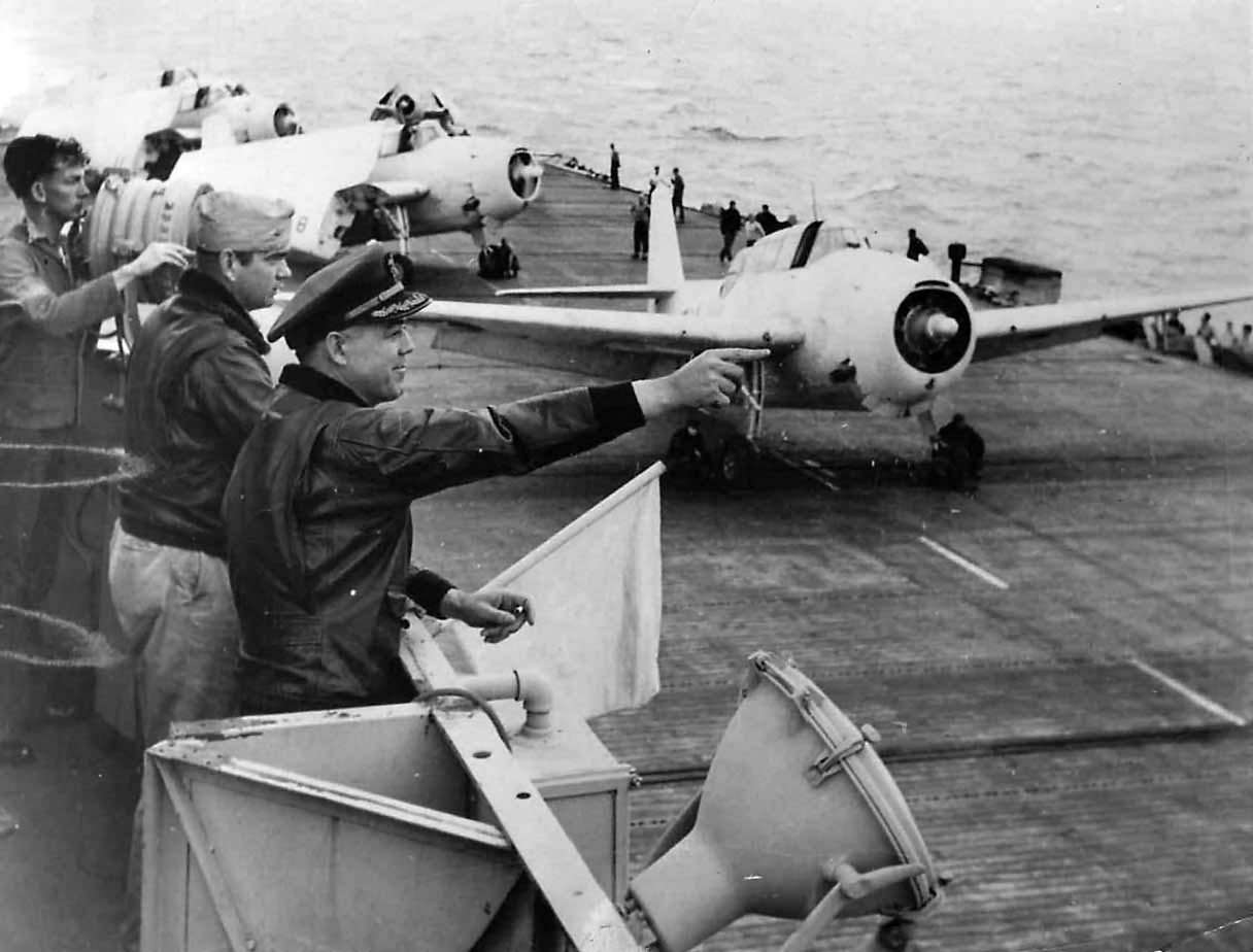 Capt Isbell, Cmdr Snider and Avengers takeoff from USS Card 1943
