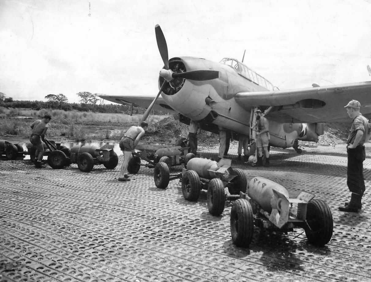 Crew loads 500 lb bombs on TBF at Guadalcanals Henderson Field