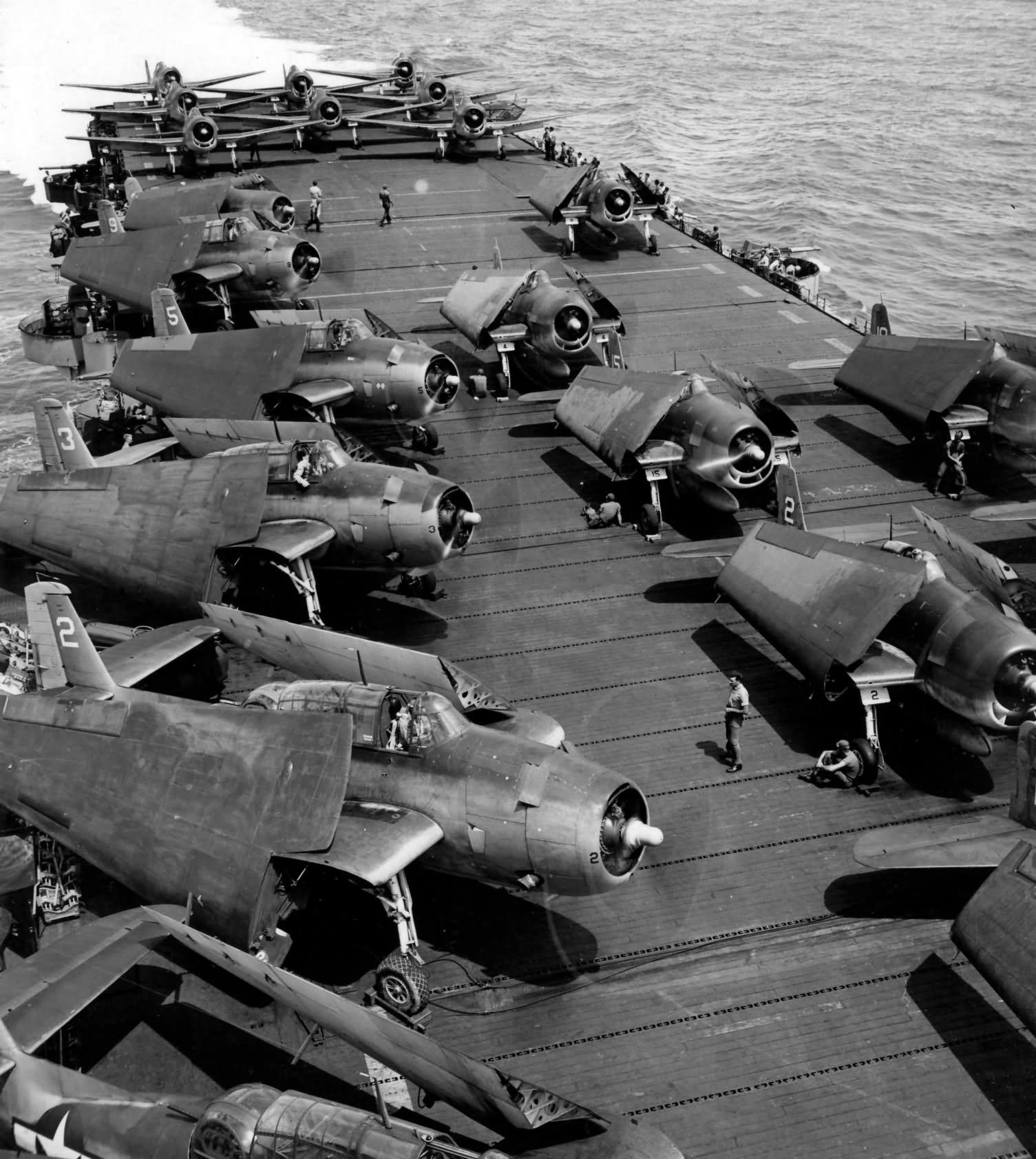 F6F-3 Hellcats and TBM-1C white 2 and 3 on the flight deck of the USS Bataan, Hawaii July 20 1944