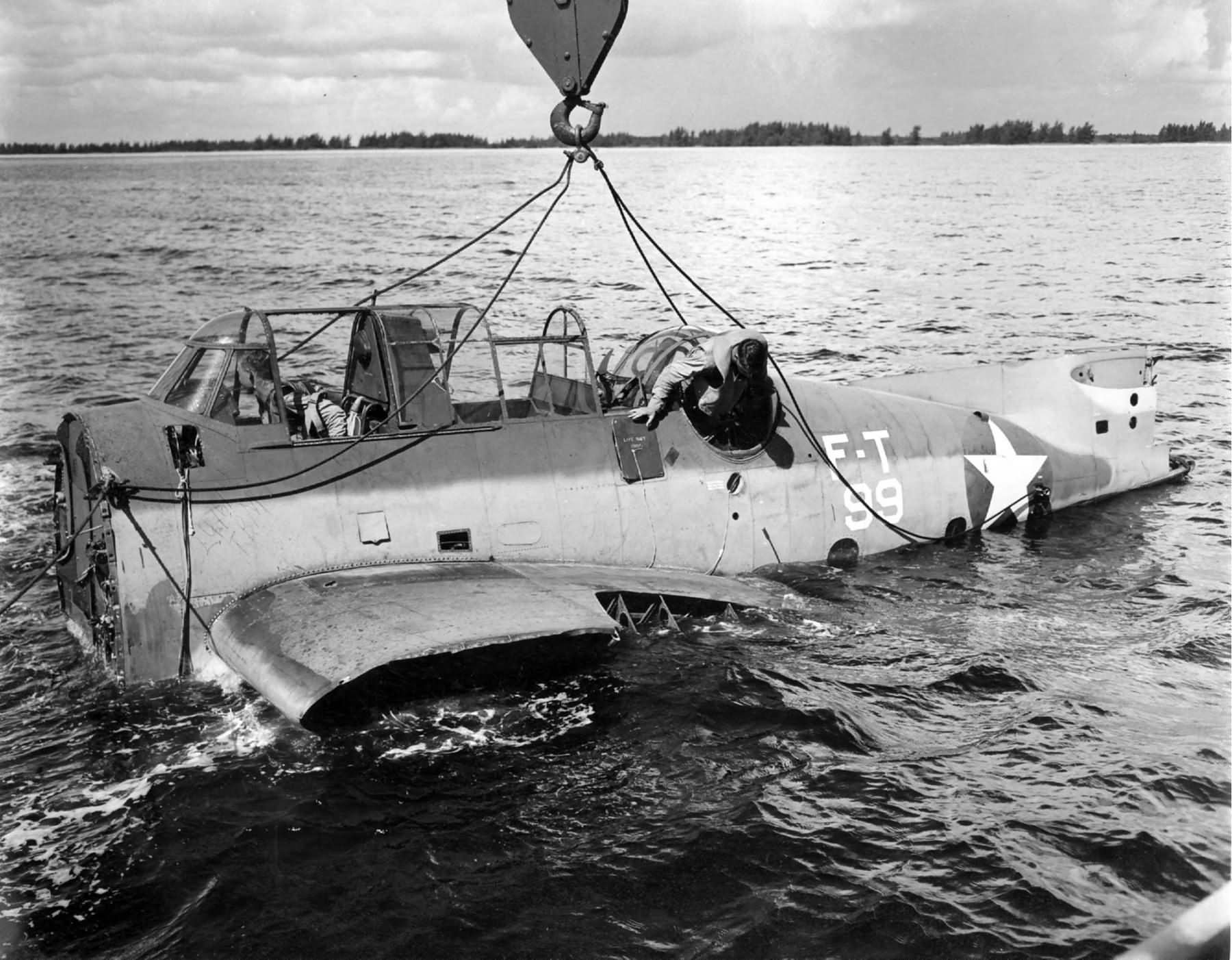 Students begin to extricate themselves from the fuselage of a TBF