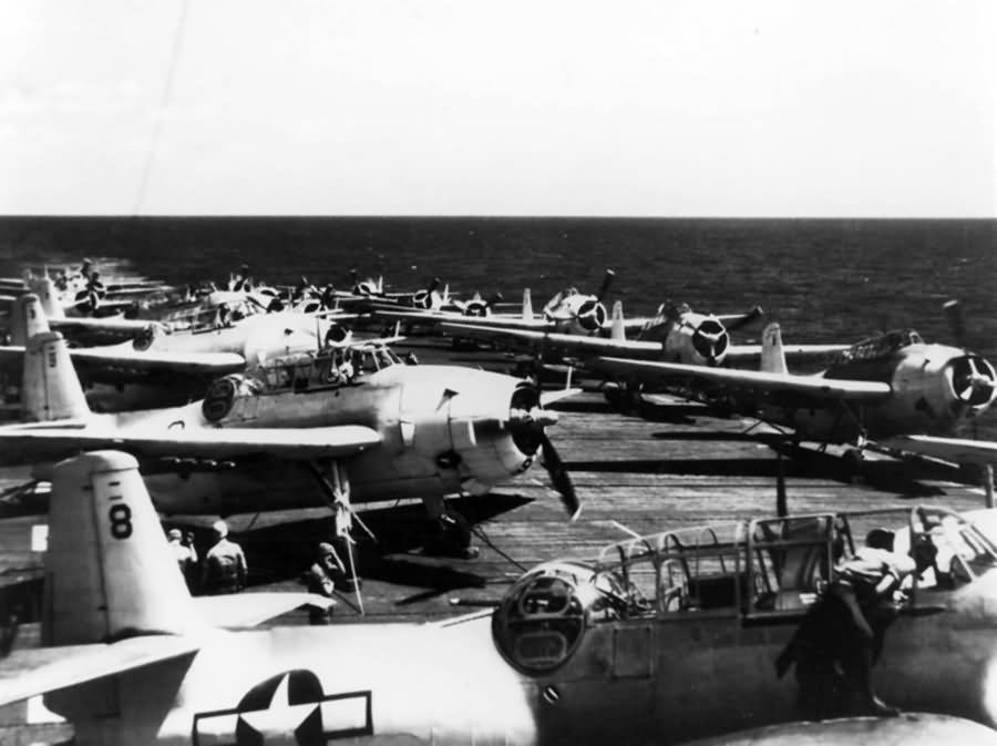 TBF-1C Avenger of the VC-6 painted in the Atlantic paint scheme of light gray and white pictured on the flight deck of the USS Tripoli CVE-64